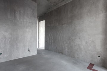 interior of the apartment without decoration in gray colors. rough finish