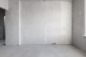interior of the apartment without decoration in gray colors. rough finish