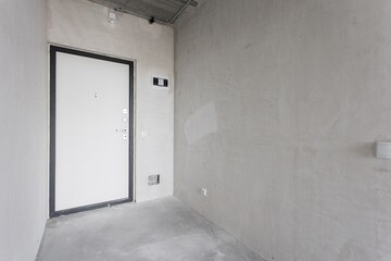 interior of the apartment without decoration in gray colors. rough finish