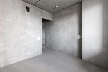 interior of the apartment without decoration in gray colors. rough finish