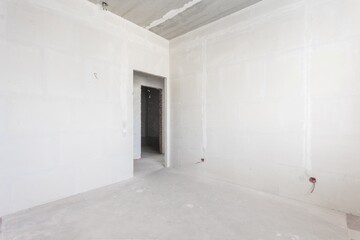 interior of the apartment without decoration in gray colors. rough finish