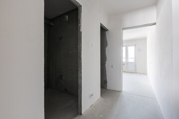 interior of the apartment without decoration in gray colors. rough finish