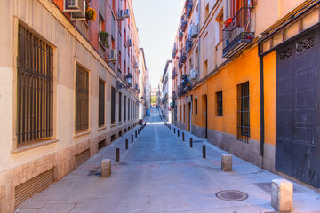 Narrow street in old Madrid downtown with colorful typical houses