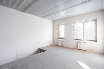 interior of the apartment without decoration in gray colors. rough finish
