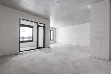 interior of the apartment without decoration in gray colors. rough finish