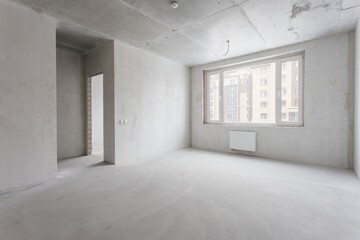 interior of the apartment without decoration in gray colors. rough finish