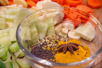Close up curry dry mix with cut vegetables