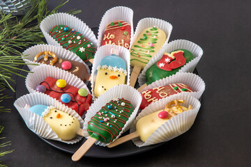 Christmas dessert. Sweet food. Cheesecake on a stick in the shape of ice cream. Kids treat in...