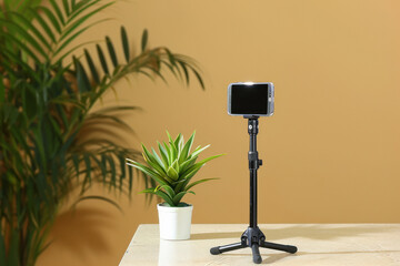 Smartphone or mobile phone in the tripod stand