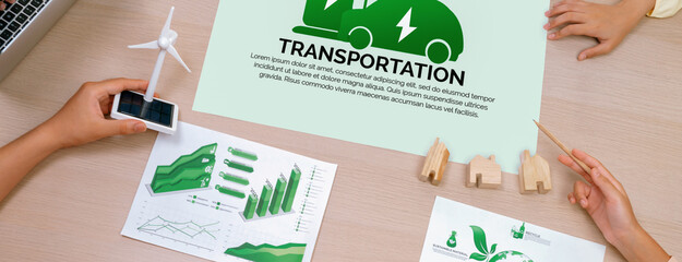 Electric vehicle poster placed on meeting table at green business meeting. ESG environment social...