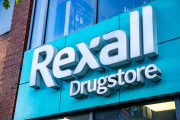 Naklejka premium Rexall Drugstore in downtown Toronto. Toronto, Canada - April 30, 2024.