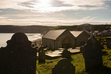 St. Hywyn's Church, Aberdaron, Wales in evening sunlight. An important place of pilgrimage which is...