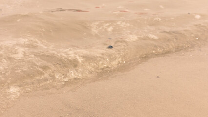 Beach sand and the sound of waves