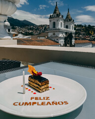 happy birthday cake with feliz cumpleaños in plate