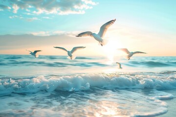 Obraz premium Graceful seagulls soar above the ocean waves, illuminated by the golden glow of a setting sun, creating a serene and picturesque scene