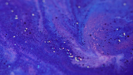 Bubble paint. Wet ink. Glitter water. Defocused blue purple color sparkling foam liquid shimmer...