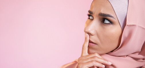 Worried face. Overwhelmed expression. Portrait of disturbed perplexed scared woman in muslim...