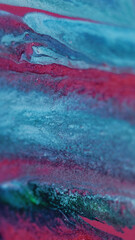 Wet glitter drip. Paint spill. Defocused pink blue green color shimmering particles texture ink...
