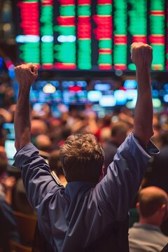 Celebrates Market Rally on Large Screen in Busy Financial Hub