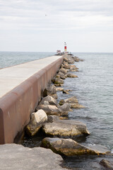 Light house warning tower on the breakwater wall