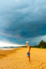 Man with drone sand water fun Bentota Beach Sri Lanka.