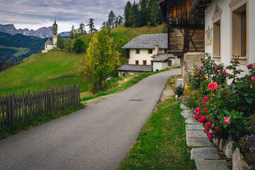 Street view with chapel of St Barbara in Dolomites, Italy