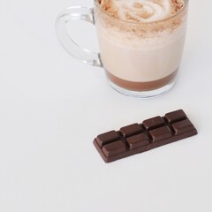 Handmade chocolate with glass of hot chocolate