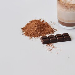 Handmade chocolate with glass of hot chocolate