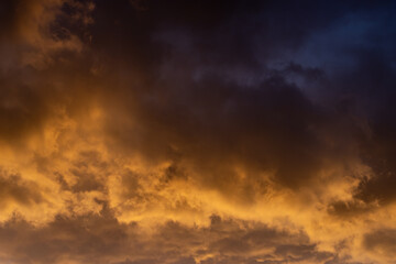 Dramatic clouds glowing at sunset, on a spring evening