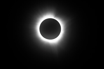 Photo during eclipse totality with visible corona of the sun.