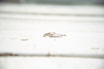 Happy day. Wedding, two wedding rings lie on the pavement.