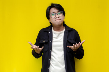 man feeling uncertain and unsure. Thoughtful asian man thinking and wondering with hand touching...