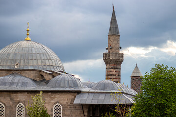 Erzurum Lala Pasa Camii or Lala Pasha Mosque and Yakutiye Madrasa under cloudy skies.