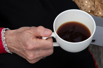 person holding a cup of coffee