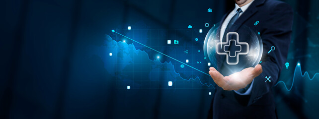 Medicare: Businessman hand holding Medicare icon with Technological Icons. Healthcare Advancements...