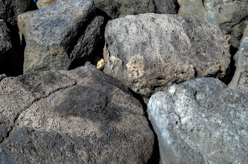 Abstract Background of Black and Gray Lava Boulders in Hawaii.