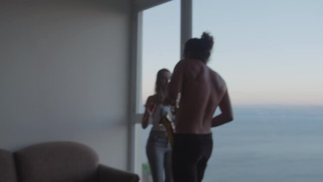Man plays saxophone and woman dances