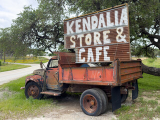 Old truck as a stand for a simple sign