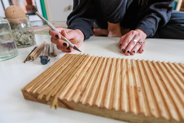 Close view of incense cones on a wooden board.