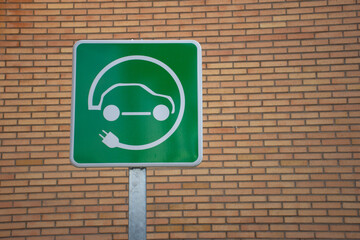 Green electric charging parking sign for zero-emission electric vehicles