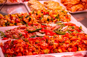 Buying vegetables and fruits in central market in Valencia, Spain