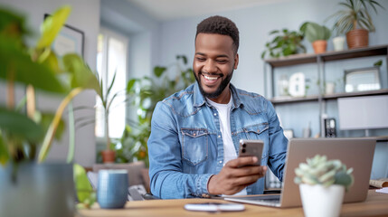 Happy African American Man Using Smartphone in Home Office