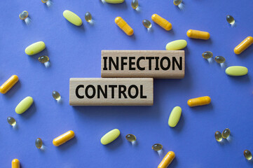 Infection Control symbol. Concept word. Infection Control on wooden blocks. Beautiful purple...