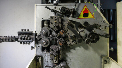 A special machine for the production of buttons for sewing.