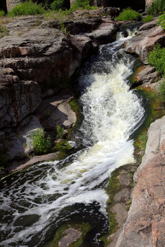 Vyr waterfall under the bridge in the Butsky canyon