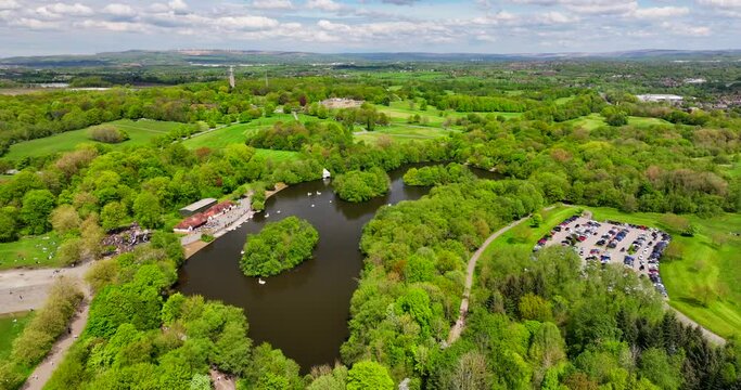Aerial video of Heaton Park Manchester showing people enjoying the day outdoors