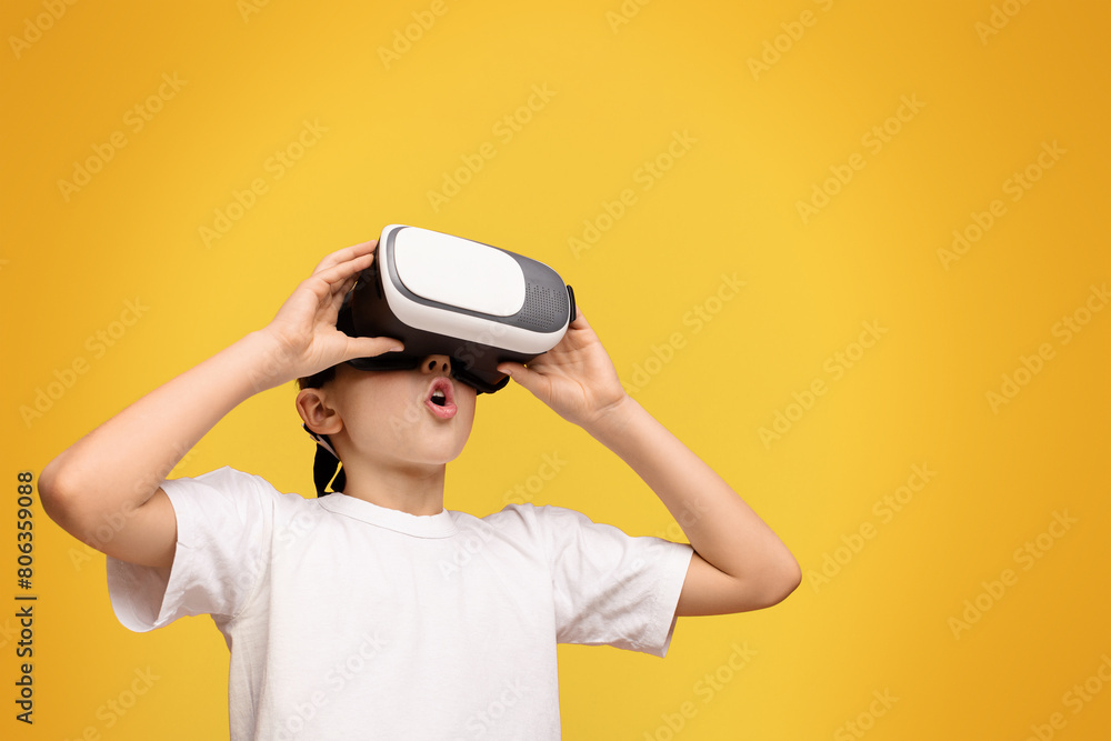 Poster a young child in awe while using a vr headset.