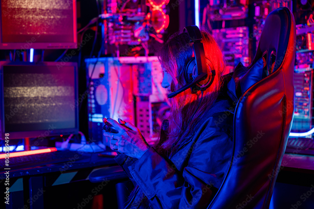 Poster gamer using joystick controller for virtual tournament plays online video game with computer neon li