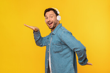 A man is depicted wearing headphones and a blue shirt, appearing to be listening to music. The...
