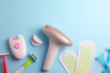Obraz premium A set of different hair removal products on a wooden table. Removal of unwanted body hair at home. 
